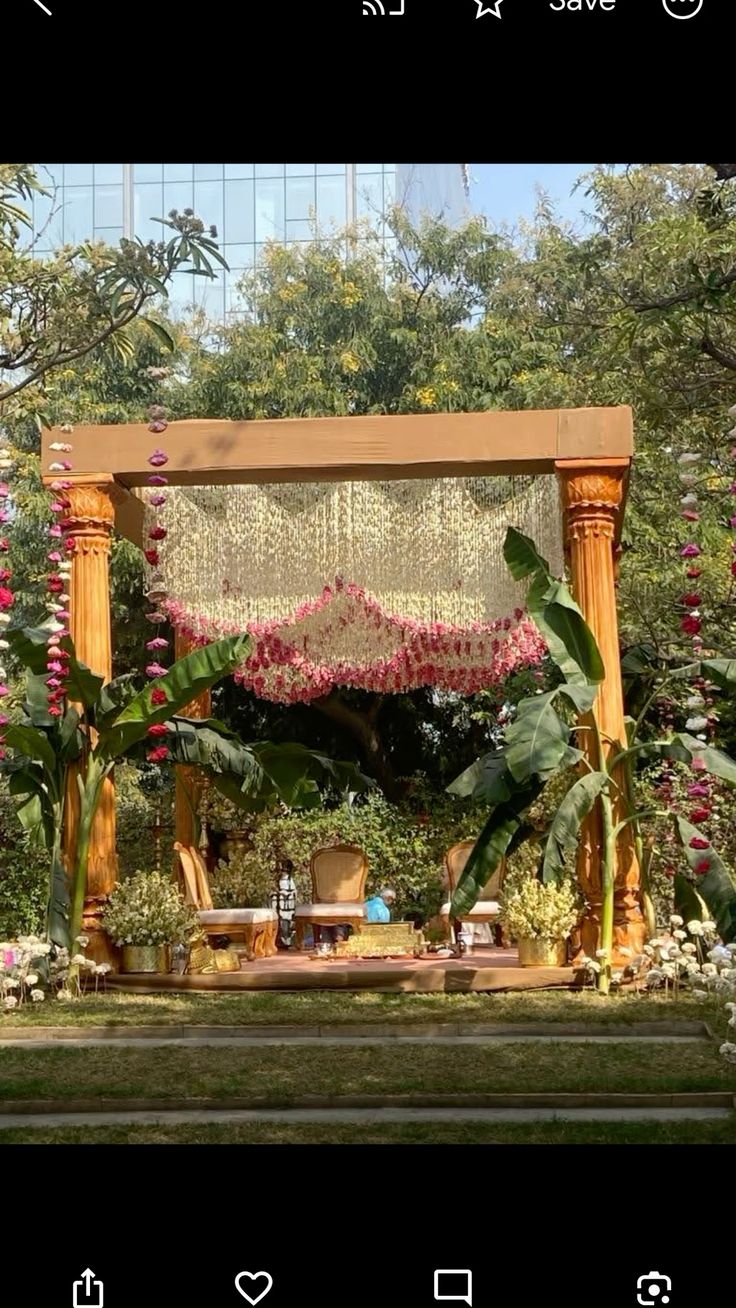 Haldi mandap with orange pillars, marigold and a fairy-light backdrop